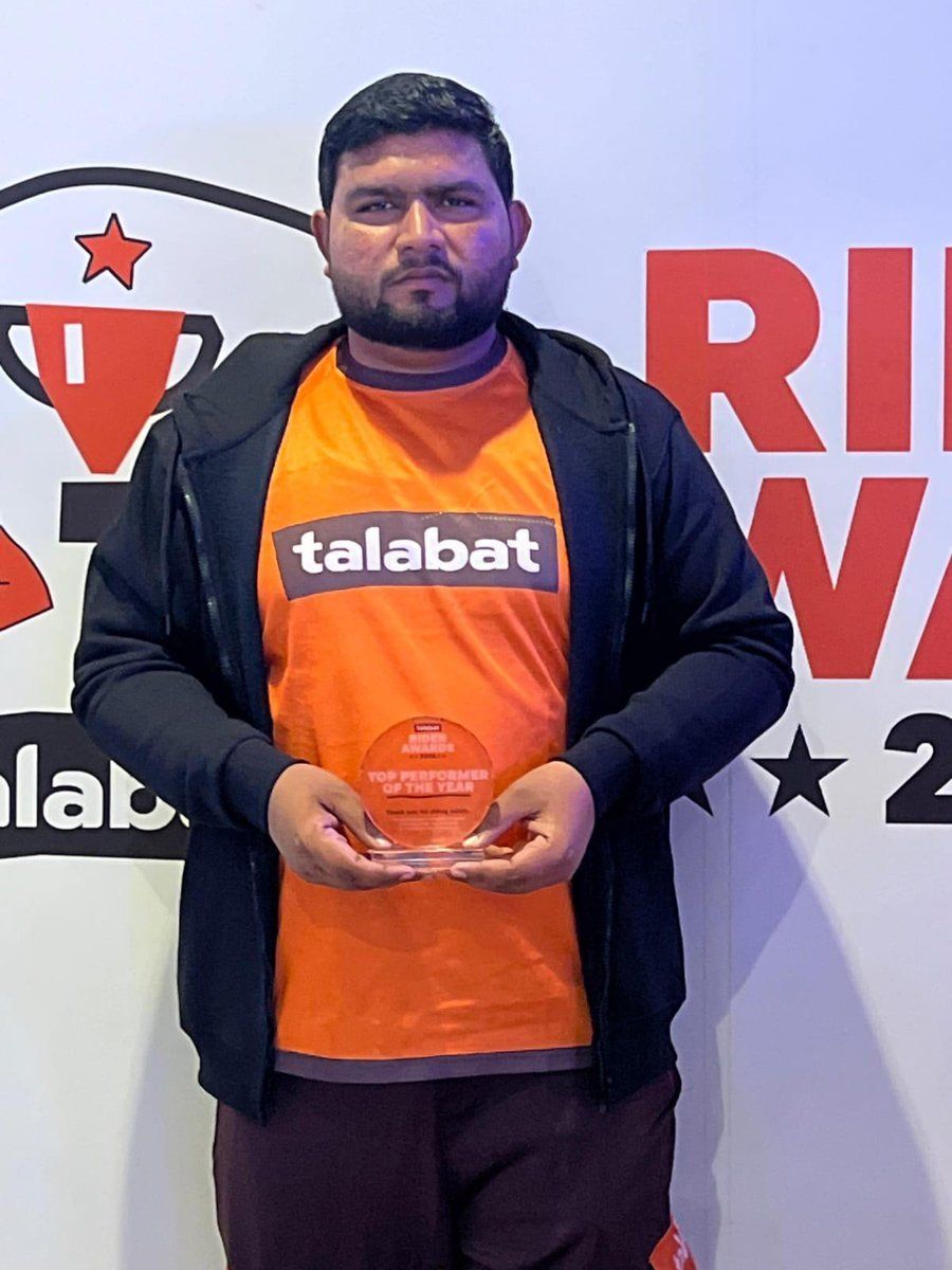Talabat Top Performer 2025 rider holding a trophy